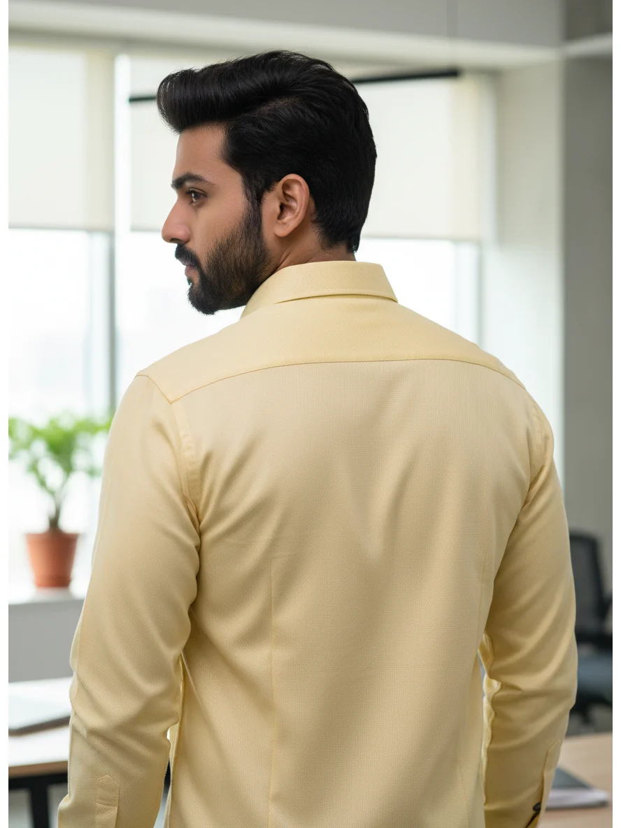 Yellow shirt, back view, collar, long sleeves, worn by a model