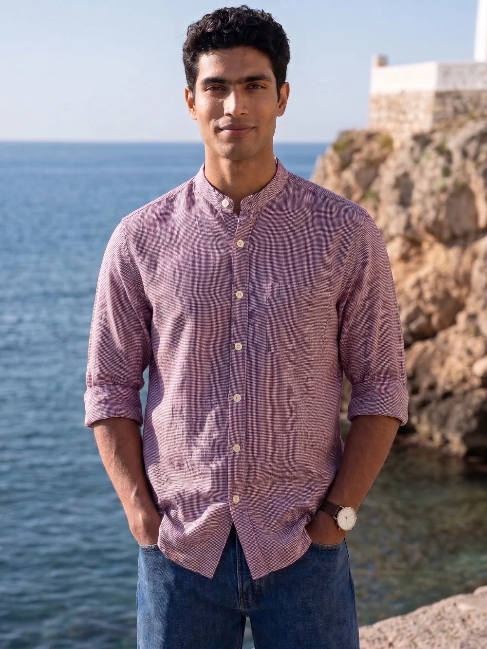 Pink checked kurta with mandarin collar, buttons, and rolled-up sleeves worn by a model