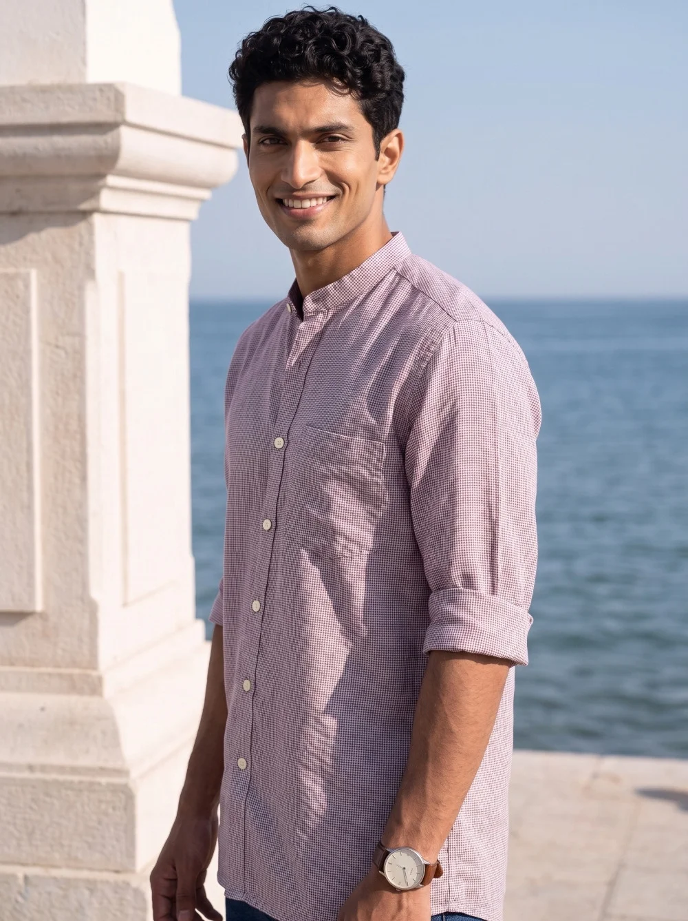 Pink checked kurta, mandarin collar, buttoned front, rolled sleeves, worn by a model
