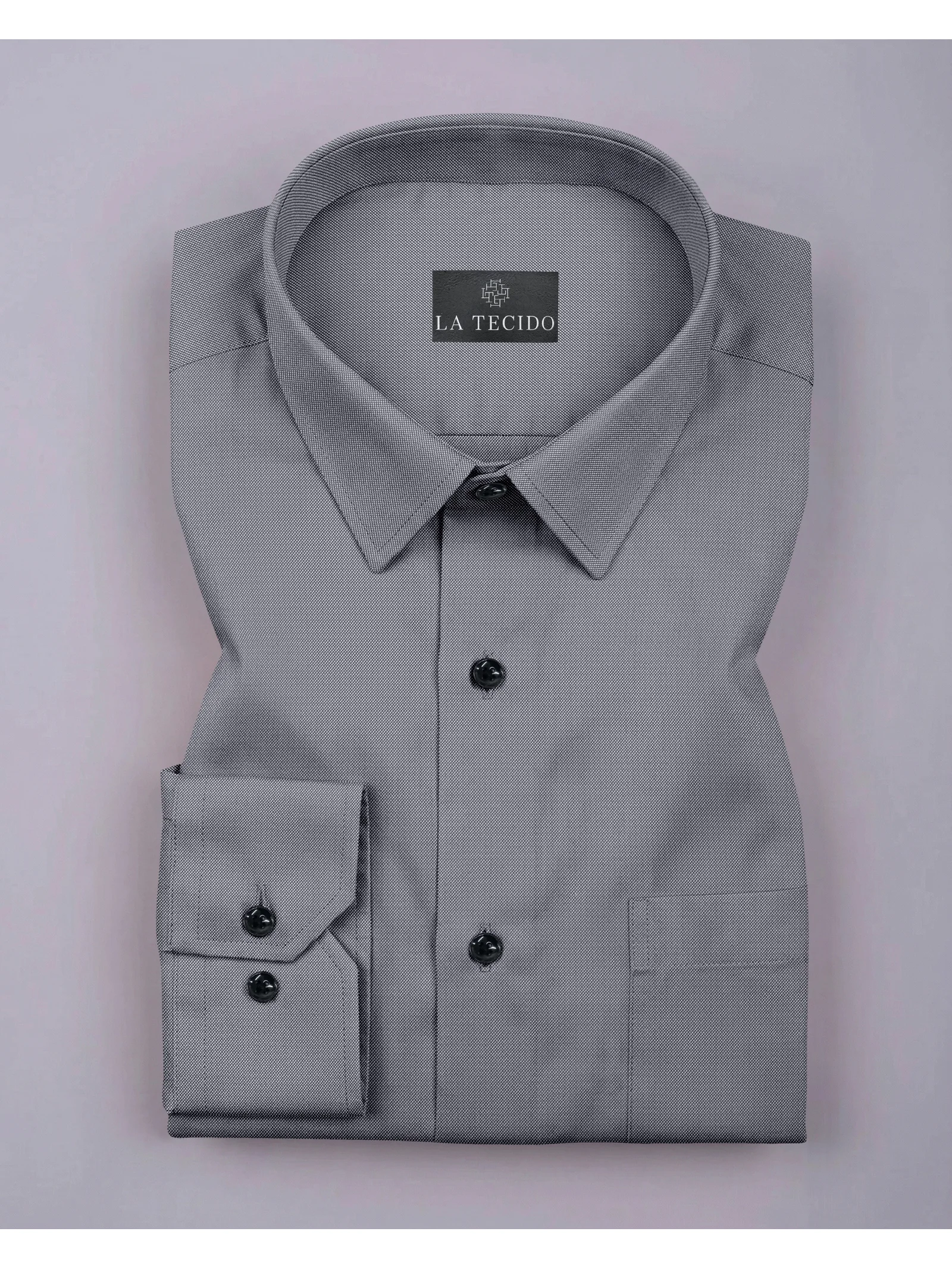 Grey dress shirt, folded, with collar, buttons, cuffs, and pocket