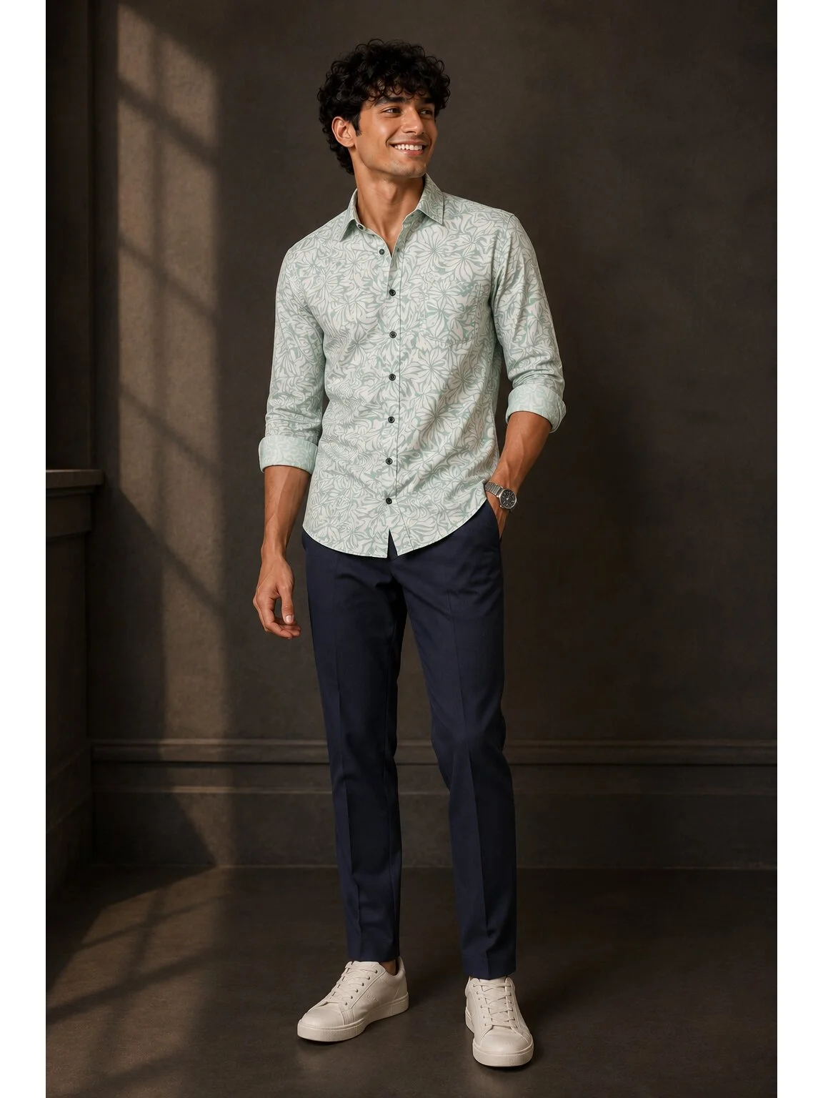 Mint green and white floral patterned shirt, front view, worn by a model, rolled sleeves, collar up, buttons down front