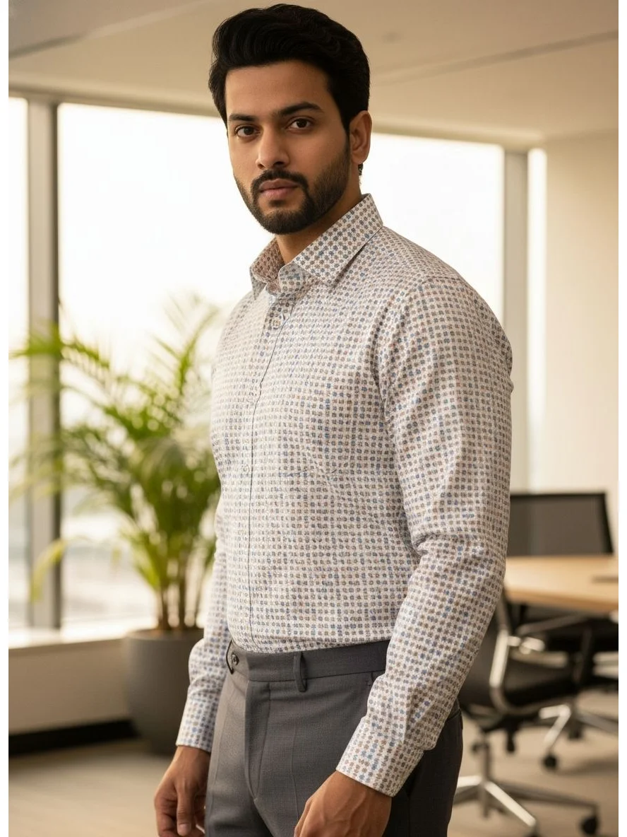 A model wearing a long-sleeve multi-color geometric print shirt with a collar, button-down front, and grey trousers