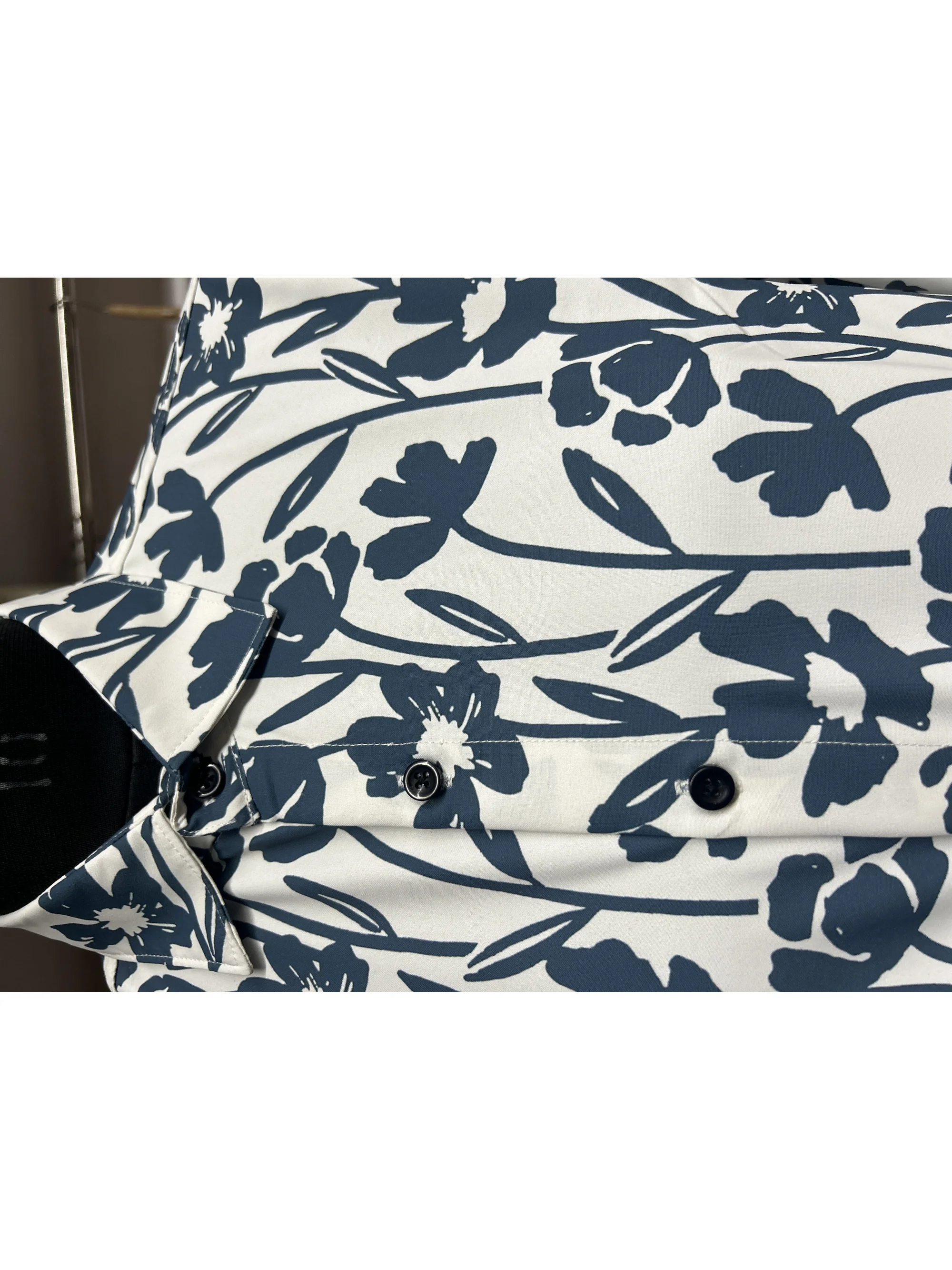 White and blue floral printed shirt, front view, buttons, collar visible