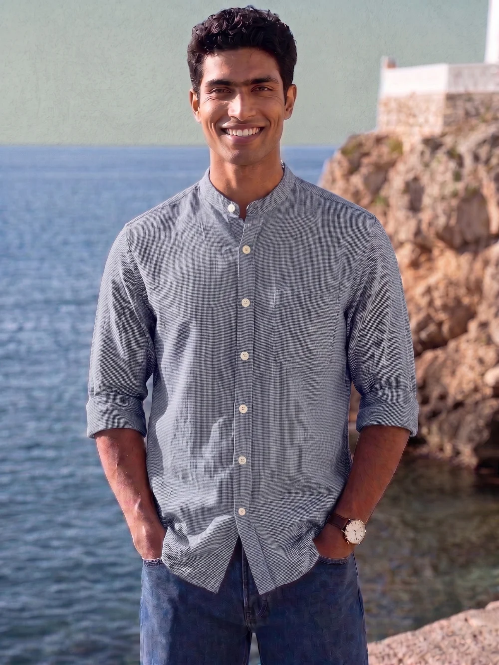 Long sleeve shirt, grey and white check, mandarin collar, buttons down front, rolled up sleeves, worn by a model