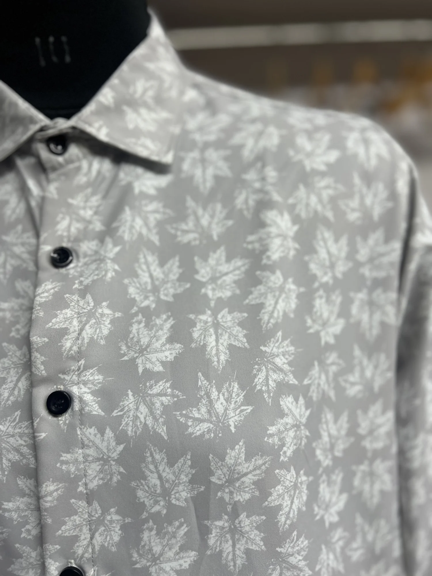 Grey and white patterned shirt, front view, collar and buttons visible