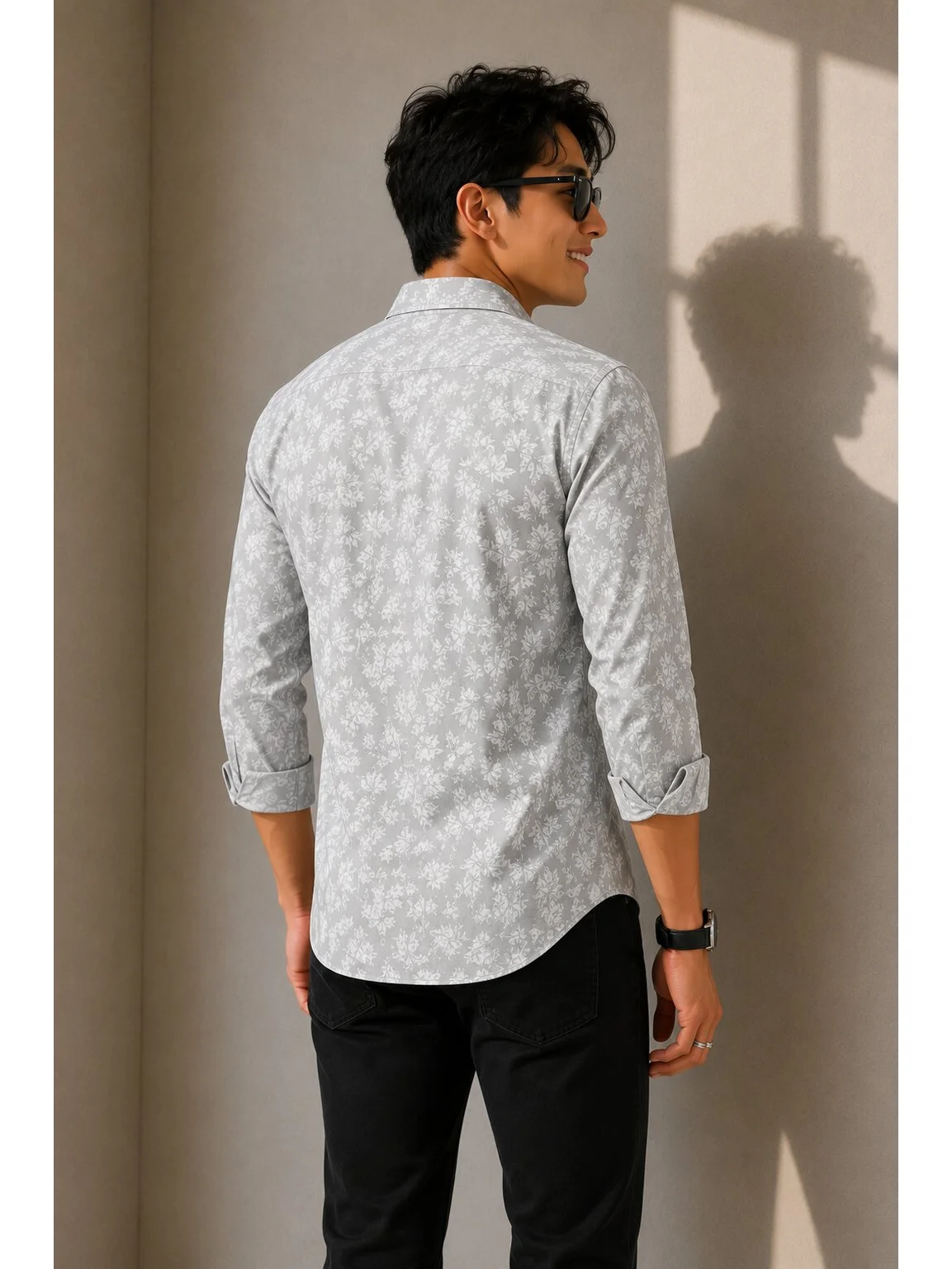 Grey and white patterned shirt, back view, worn by a model, cuffed sleeves