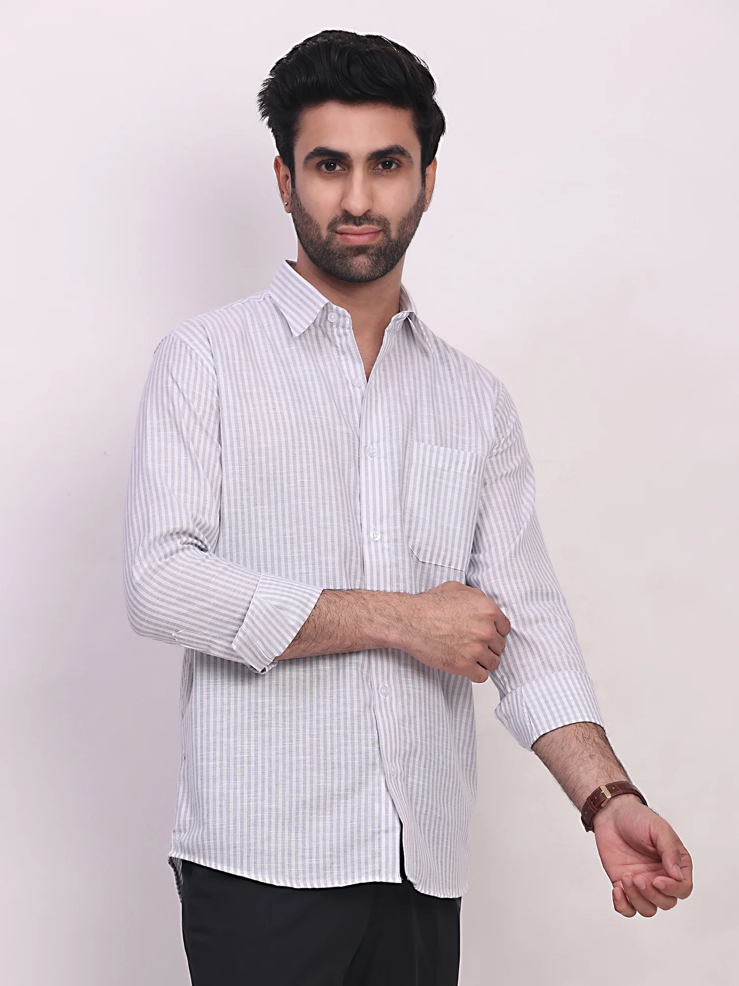 Grey striped shirt, front view, worn by a model, long sleeves, collar, buttoned up, chest pocket
