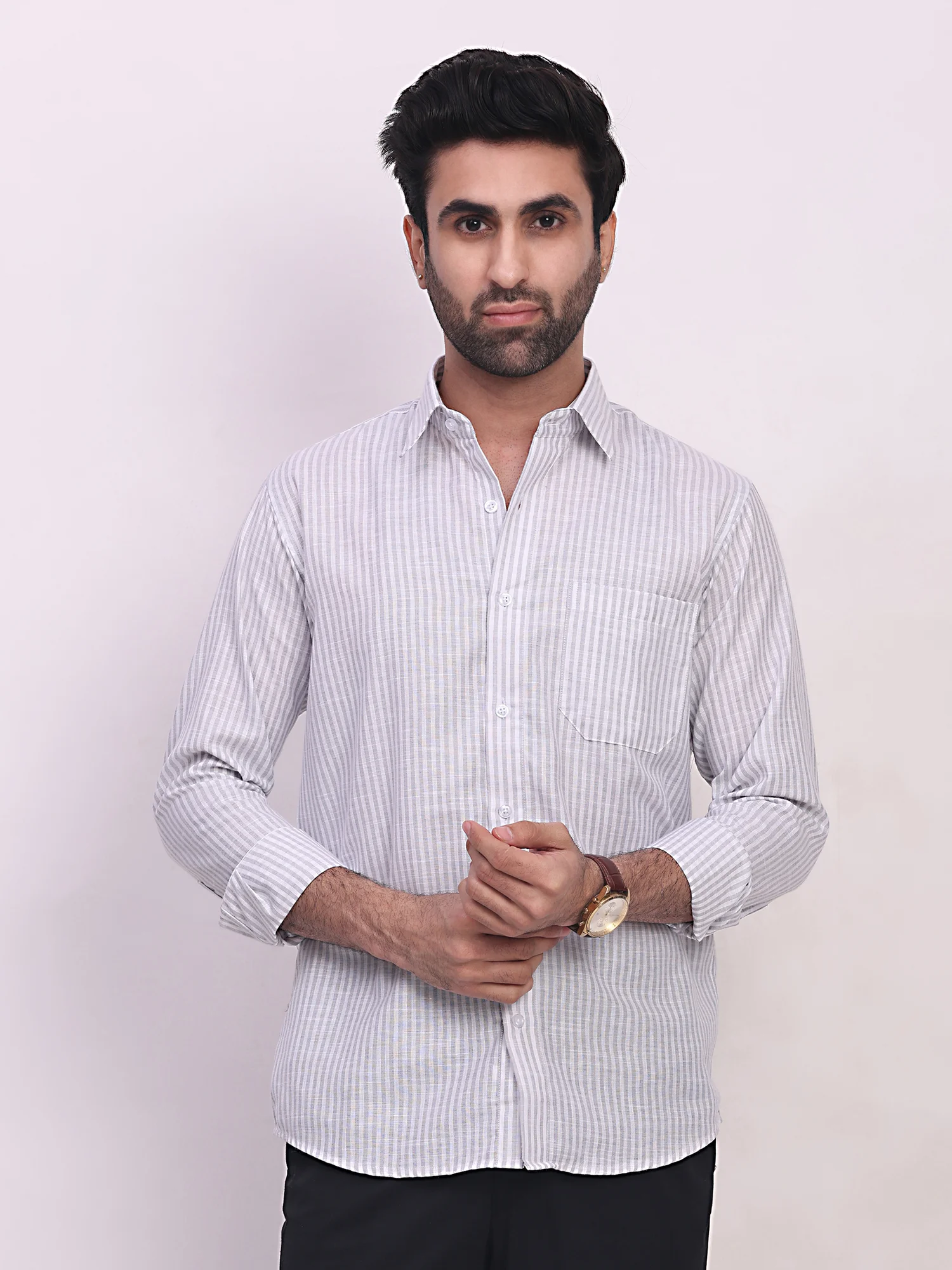 Grey striped shirt, front view, worn by a model, long sleeves, buttoned chest, collar visible