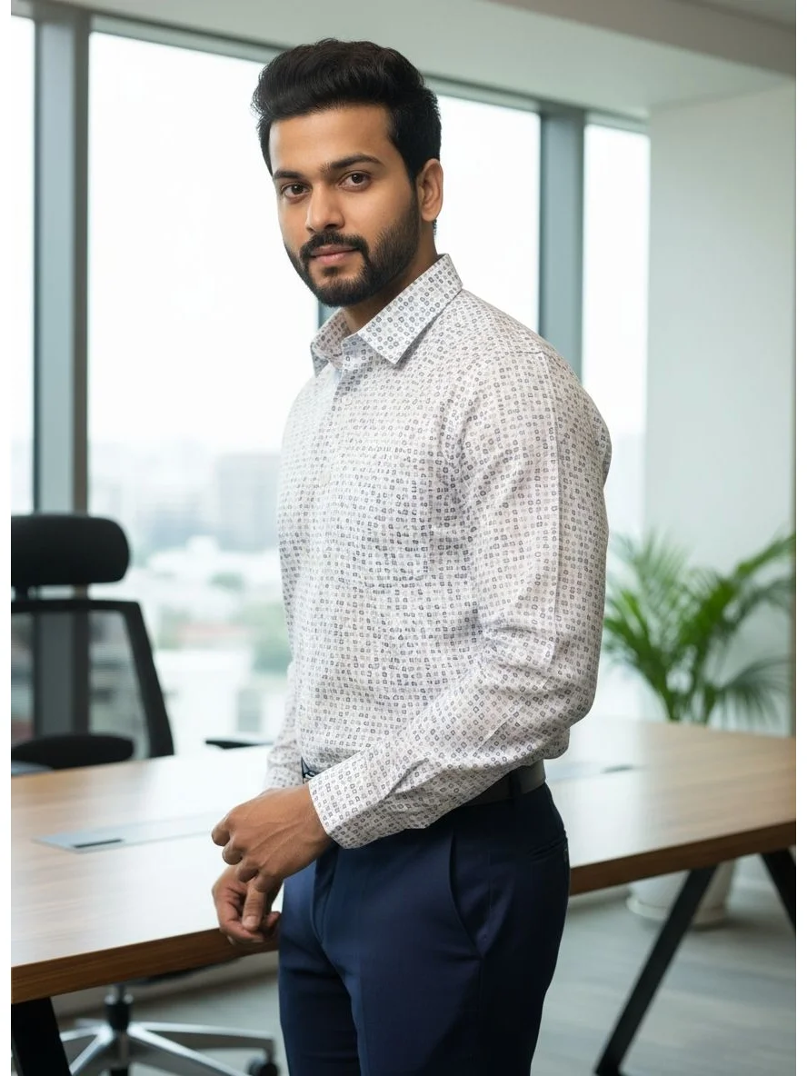 Model wearing a long-sleeve white shirt with a small geometric print, collar, and blue trousers in a side view